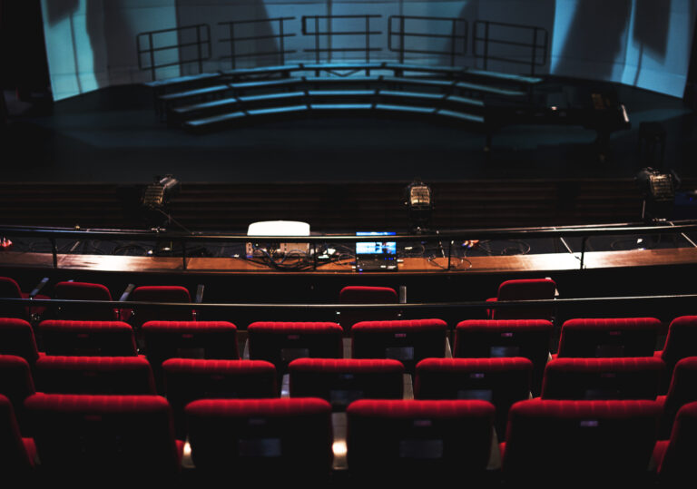 Rows of red seats in a theater